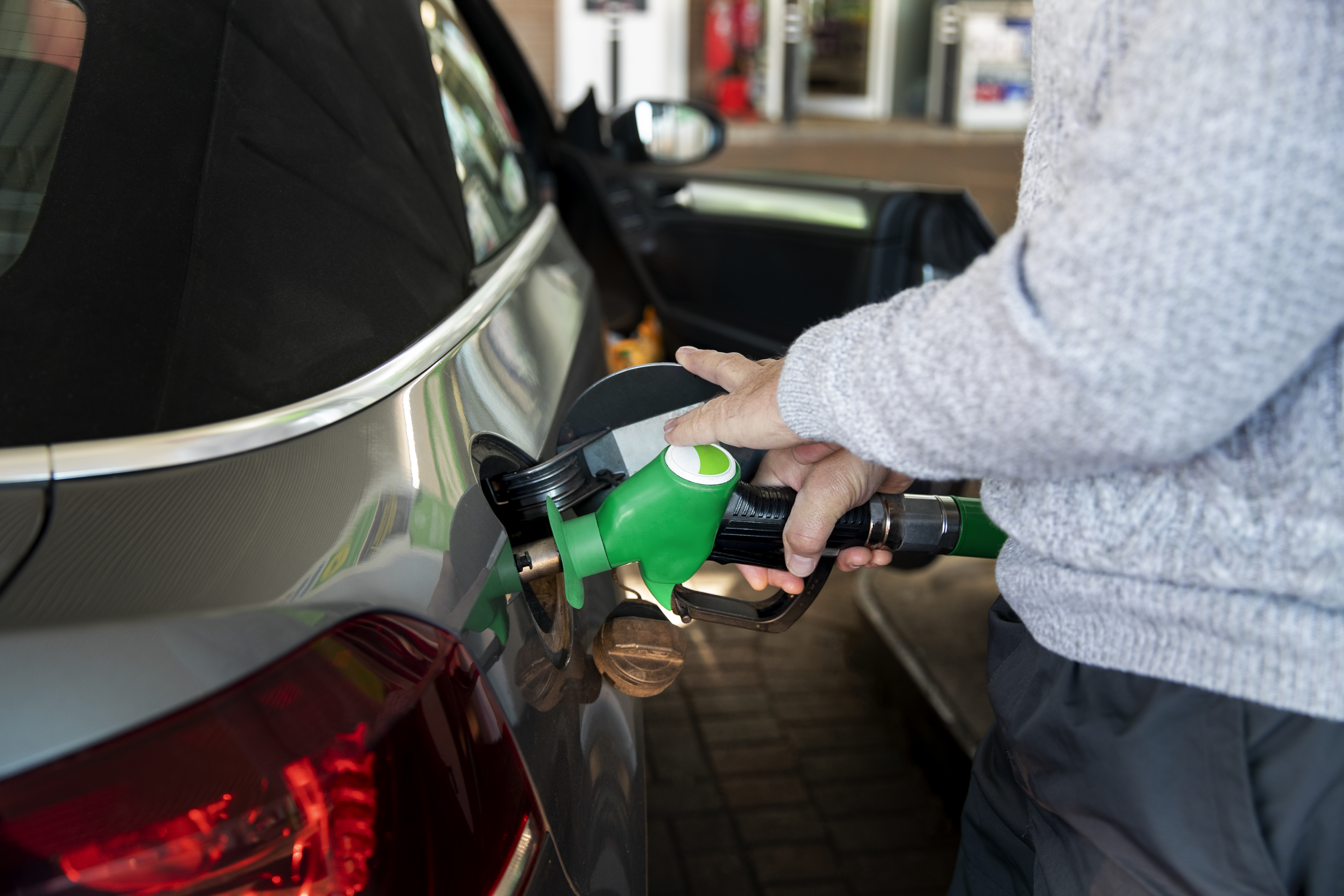 close-up-hand-pumping-gas-car.jpg