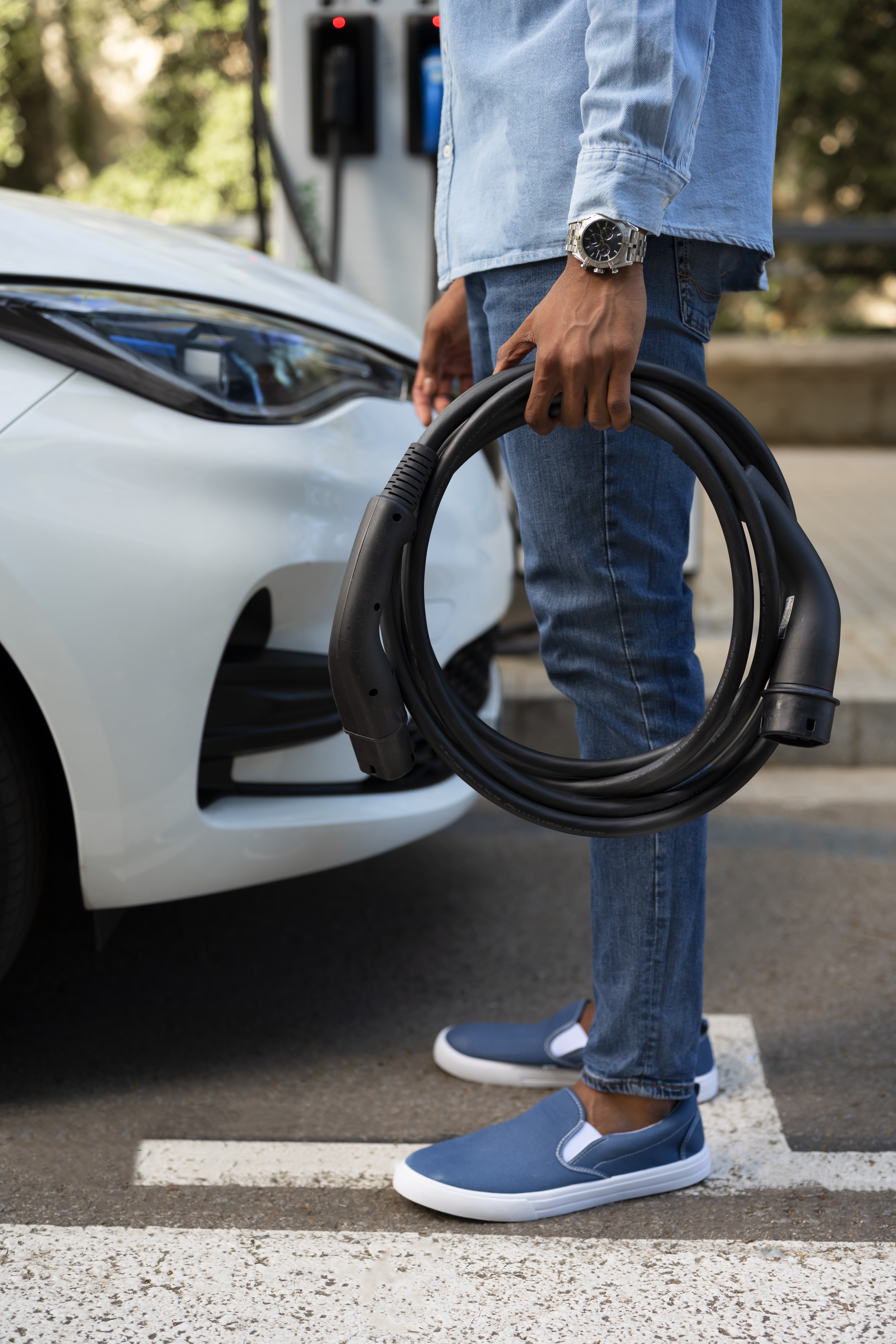 side-view-man-holding-charging-cable.jpg