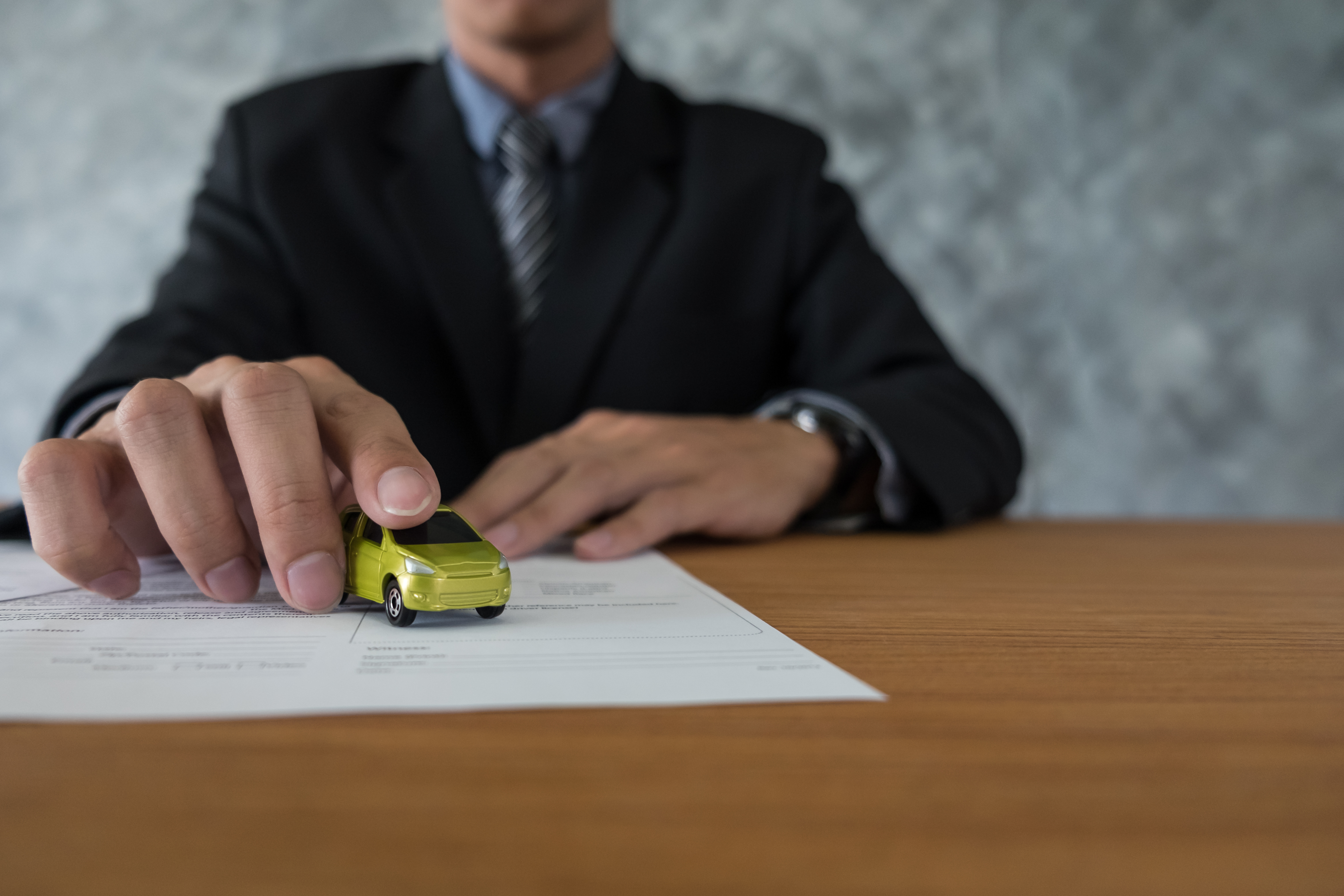 transportation-ownership-concept-customer-salesman-with-car-key.jpg