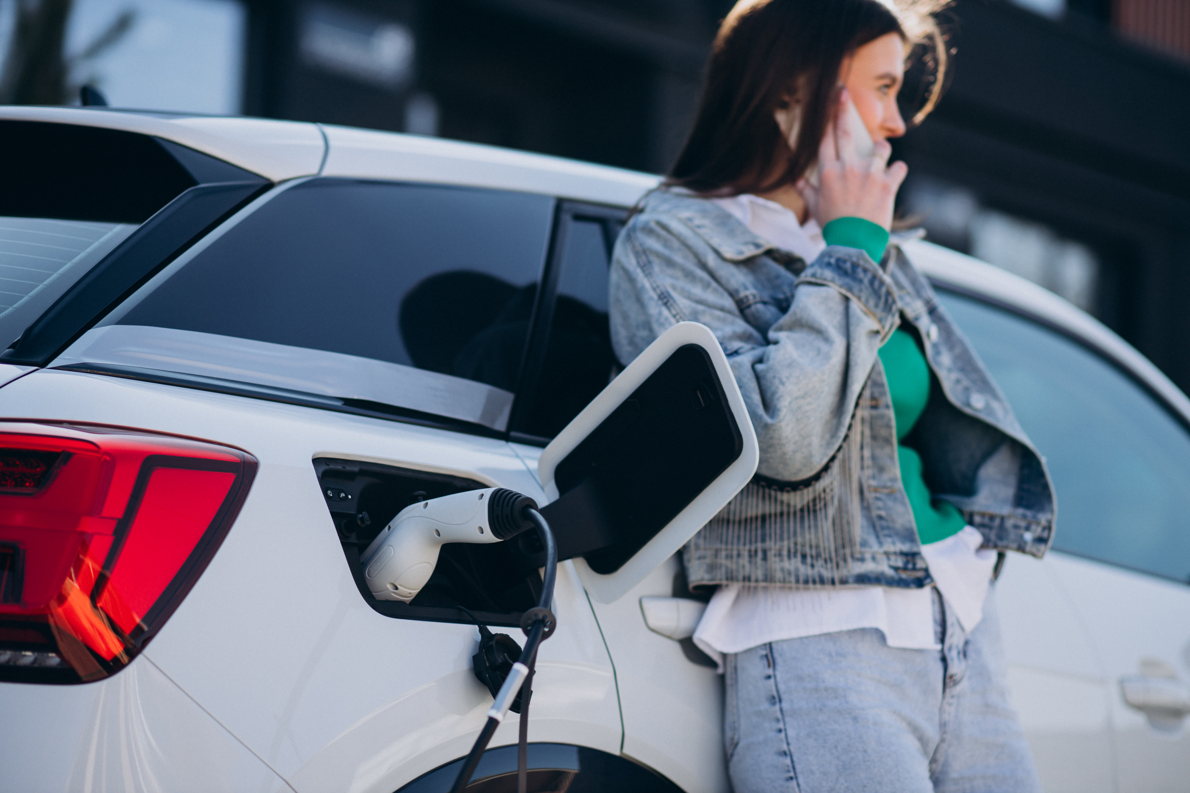 woman-charging-her-electric-car-with-charging-pistol (1).jpg