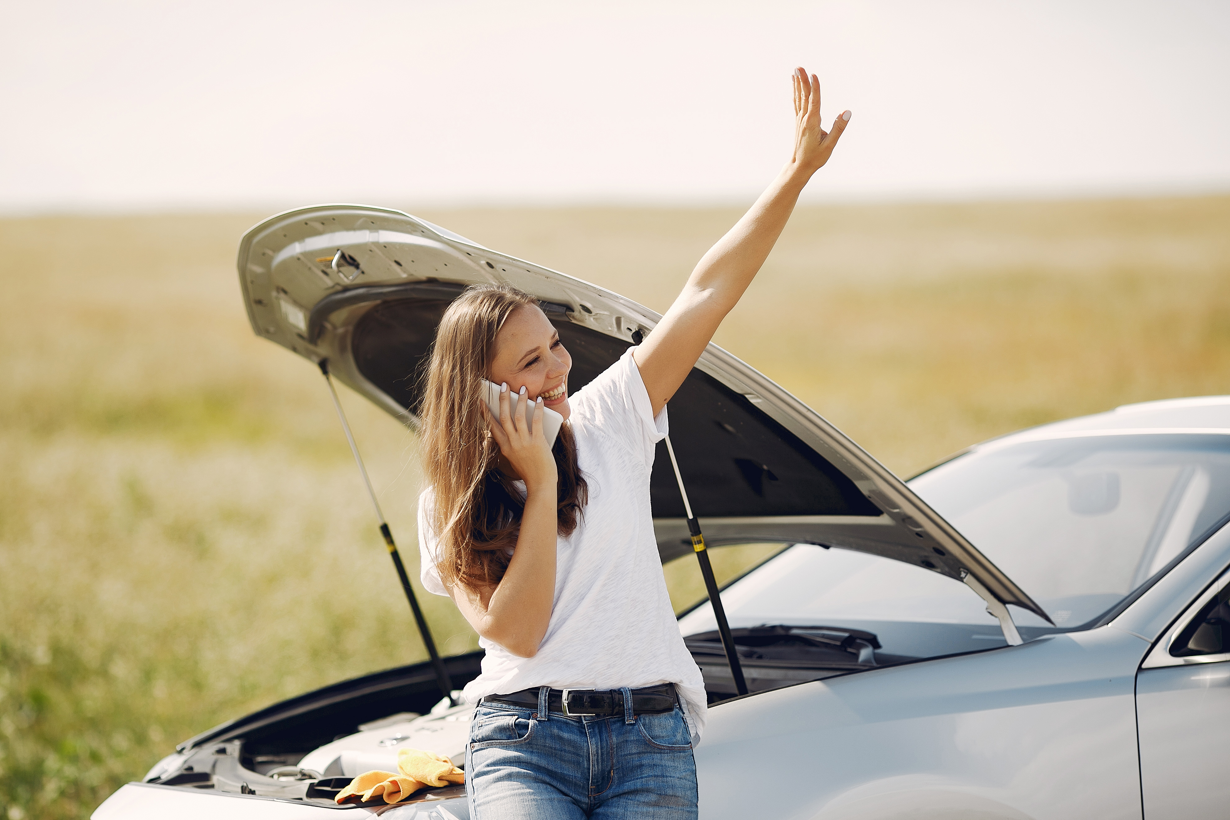 woman-near-broken-car-call-help.jpg